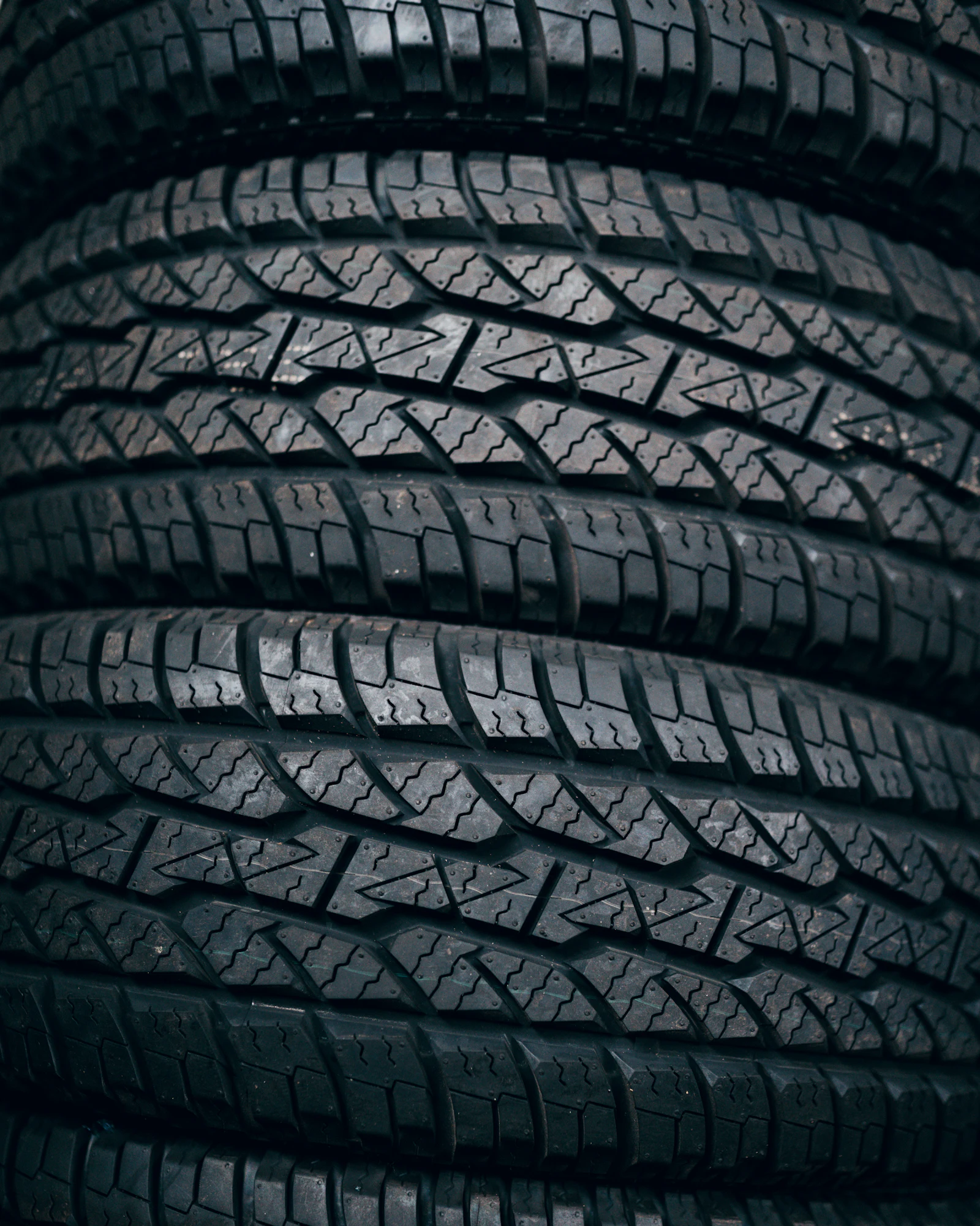 Stack of new light truck tires with all-terrain tread